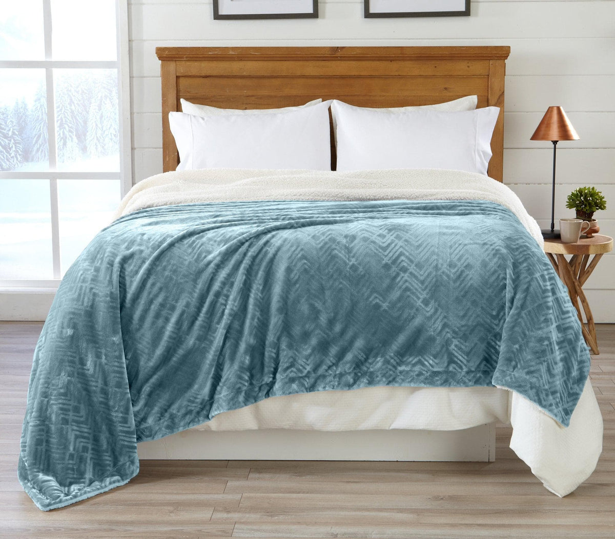 Velvet plush sherpa bed blanket teal from Great Bay Home, draped over a wooden headboard on Tampa Home & Garden Store