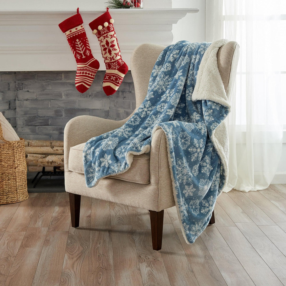 Velvet Plush Sherpa Bed Blanket - Cielo Collection with snowflakes draped over beige chair on Tampa Home & Garden Store