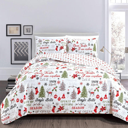 Quilt Set Carol Collection by Great Bay Home on bed with festive Christmas prints on Tampa Home & Garden Store