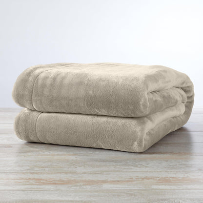 Velvet Plush Sherpa Luxury Bed Blanket beige folded on light wood floor on Tampa Home & Garden Store