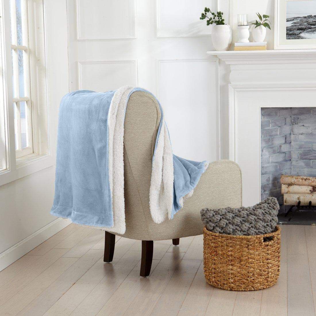 Great Bay Home Velvet Plush Sherpa Luxury Bed Blanket Kinsley light blue draped over beige seat on Tampa Home & Garden Store