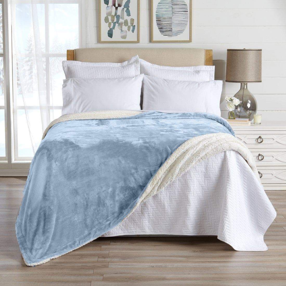 Velvet Plush Sherpa Bed Blanket Kinsley Collection by Great Bay Home in blue on bed on Tampa Home & Garden Store