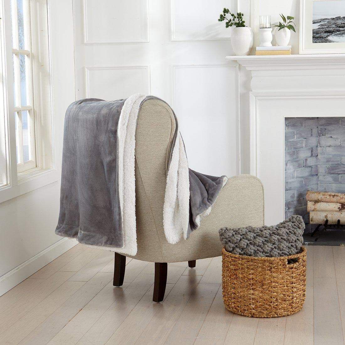 Grey Velvet Bed Blanket by Great Bay Home white sherpa lining on beige chair on Tampa Home & Garden Store