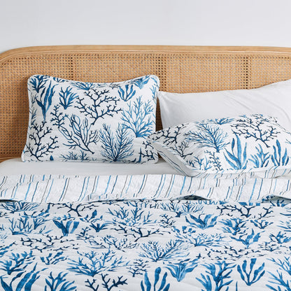 Coastal Navy Coral Quilt Set by Great Bay Home on rattan headboard bed with blue coral print on Tampa Home & Garden Store