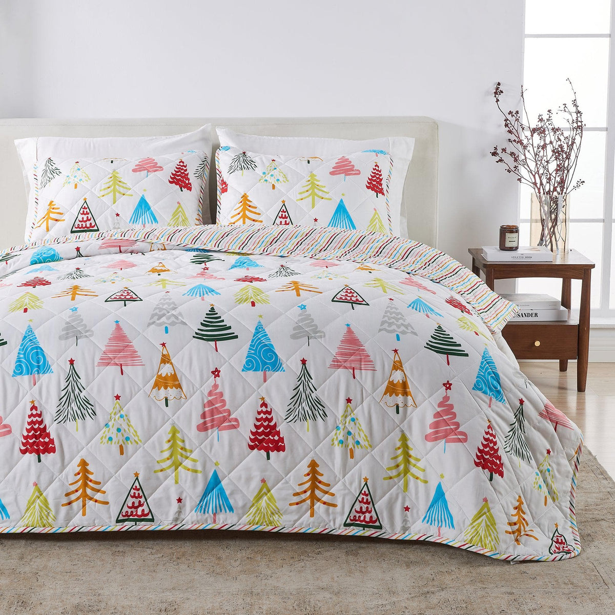 Colorful Holiday Quilt Set by Great Bay Home with Christmas tree prints and white background on Tampa Home & Garden Store