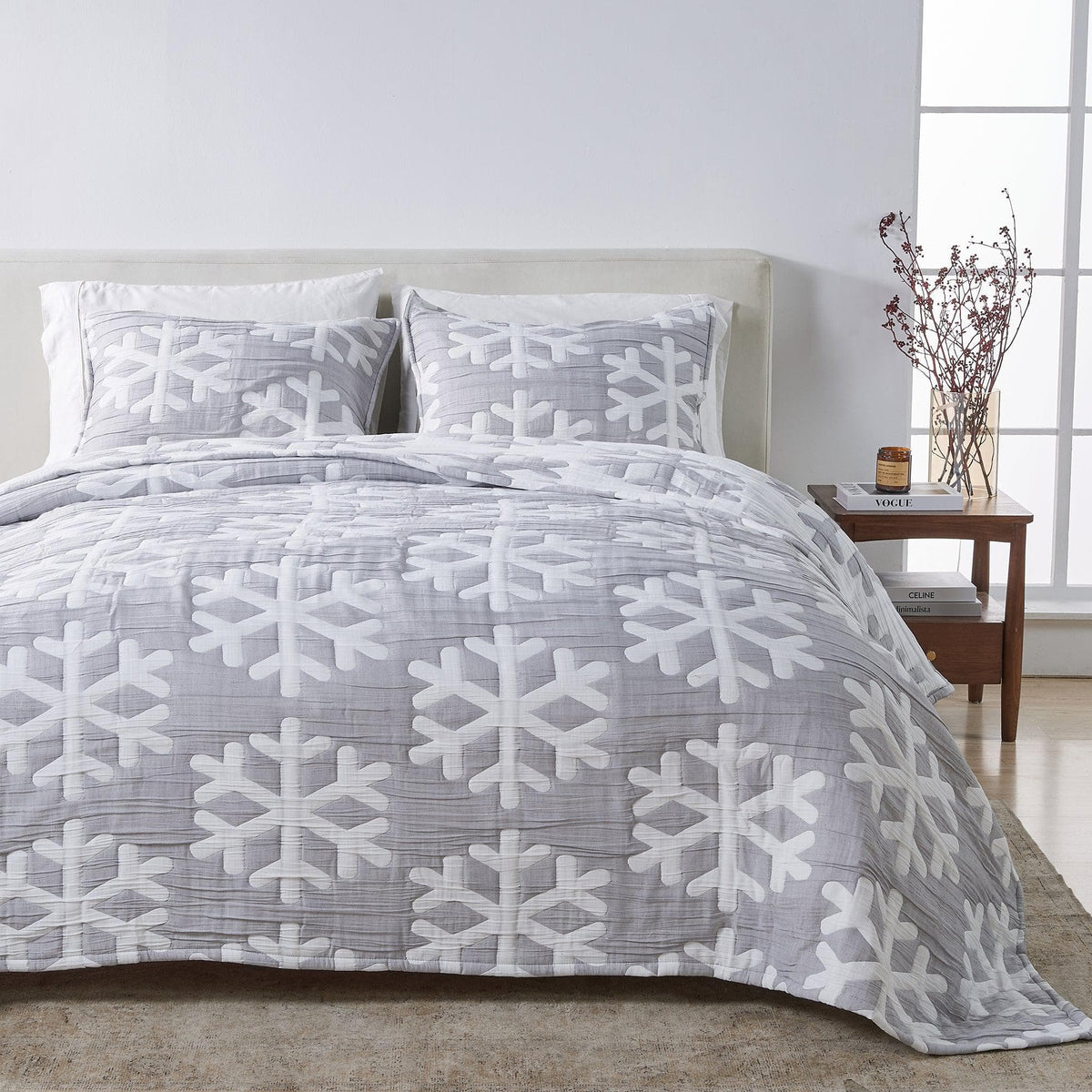 Matelassé Snowflake Quilt Set Nino Collection by Great Bay Home; gray quilt with white snowflake motif and matching shams on bed on Tampa Home & Garden Store