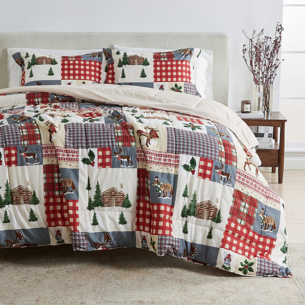 Reversible Christmas comforter and sham set by Great Bay Home with lodge patchwork in red plaid and pine trees on bed on Tampa Home & Garden Store