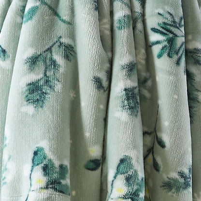 Velvet plush sherpa blanket with teal botanical print on a light background on Tampa Home & Garden Store