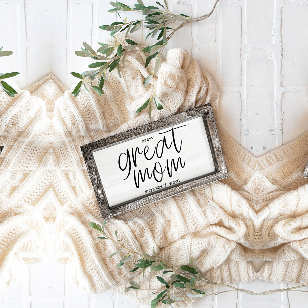 Great Mom Sign rustic framed white panel by Gia Roma on cream knit backdrop with greenery on Tampa Home & Garden Store
