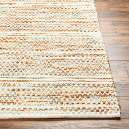 Griet Hand Woven Wool Rug Boutique Rugs white orange gray dotted pattern on wood floor on Tampa Home & Garden Store