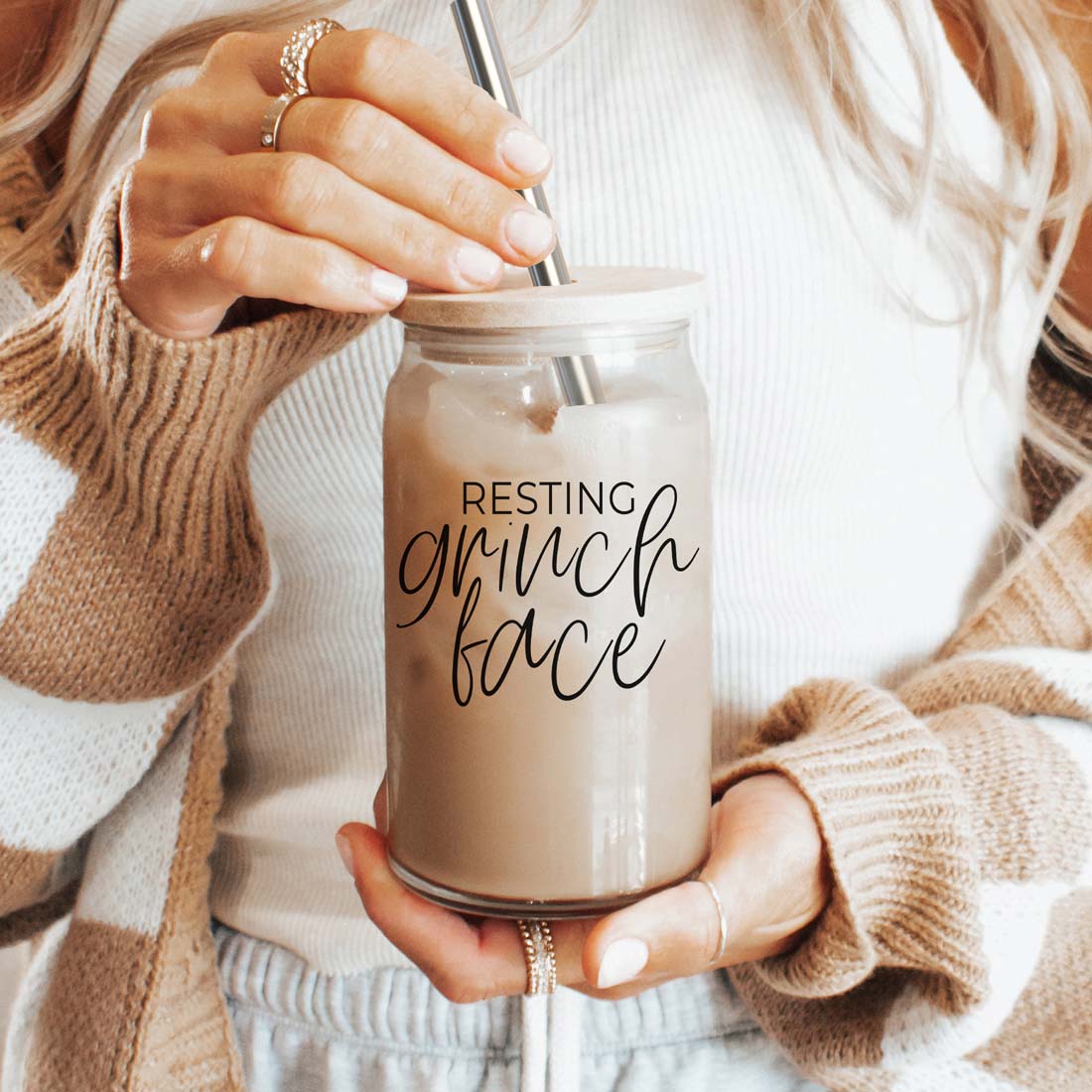Grinch Face 17oz glass cup with lid and metal straw, beige iced drink, Gia Roma drinkware on Tampa Home & Garden Store