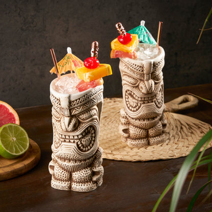 Viski Pacific High Tide tiki mugs 2 stemless cocktail glasses with carved tiki figures on Tampa Home & Garden Store