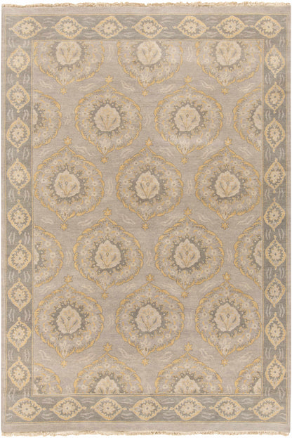Haleiwa Clearance Rug, taupe gray field with cream and gold medallions, fringed border on Tampa Home & Garden Store