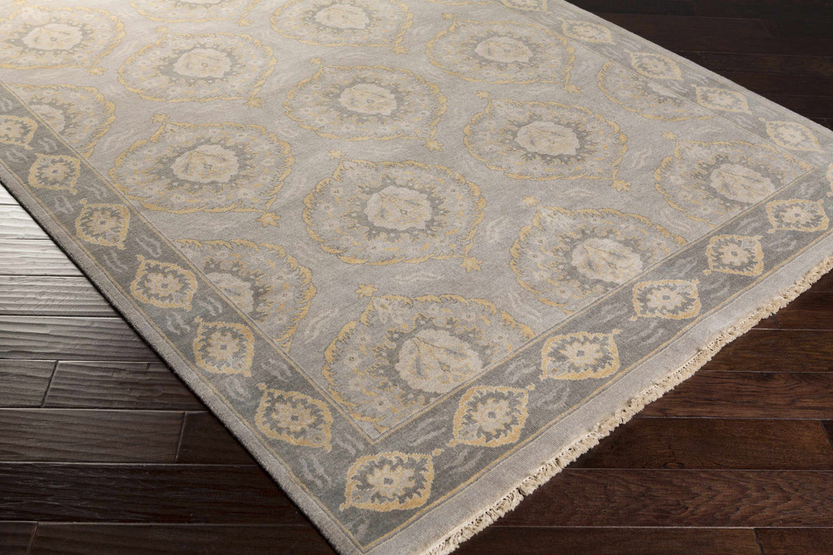 Haleiwa Clearance Rug by Boutique Rugs, gray field with gold ornate medallions, bordered on Tampa Home & Garden Store