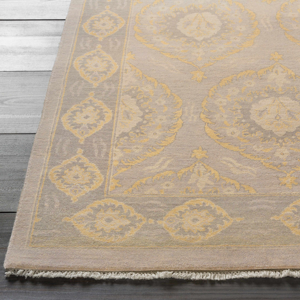 Haleiwa Clearance Rug by Boutique Rugs beige gray with yellow medallion motif and fringe on Tampa Home & Garden Store