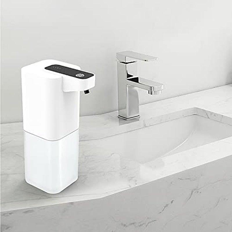 Automatic touchless foaming soap dispenser white on marble bathroom counter beside chrome faucet on Tampa Home & Garden Store