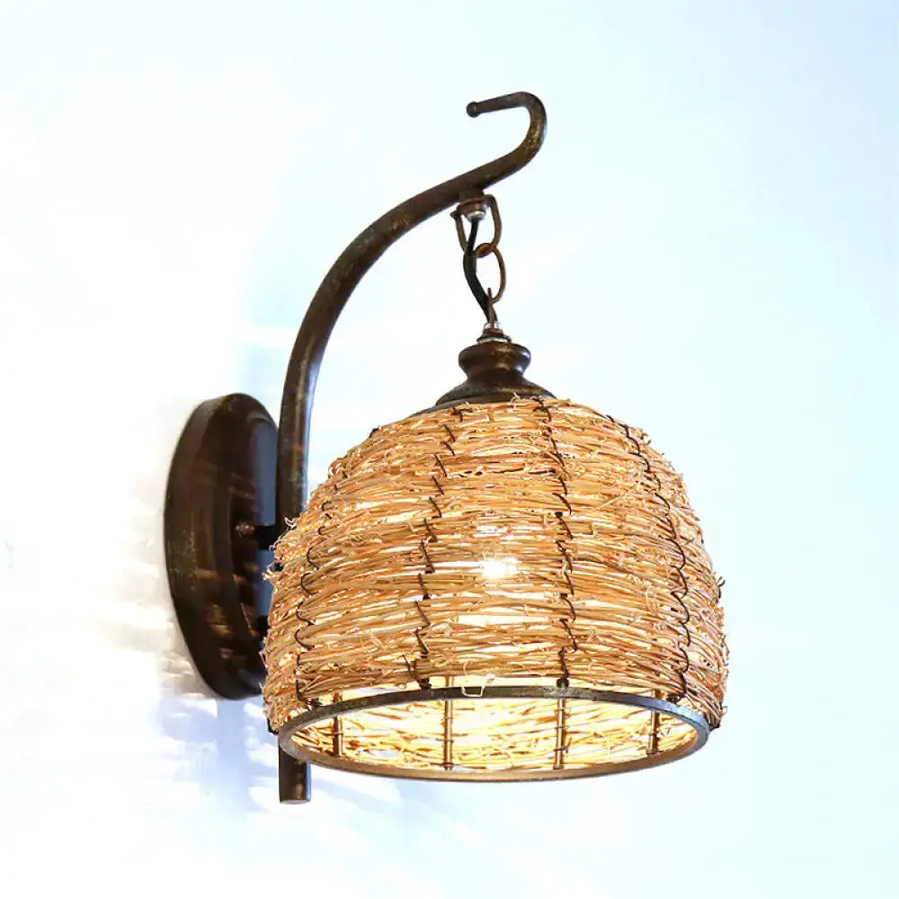 Handmade Asian rattan dome wall sconce by Decorbites, brown shade with curved iron arm on Tampa Home & Garden Store