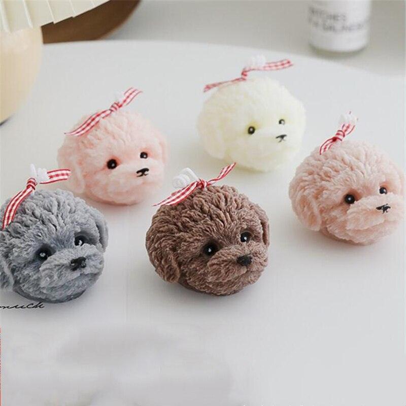 Bear-shaped scented candles in five colors with red ribbon bows on Tampa Home & Garden Store