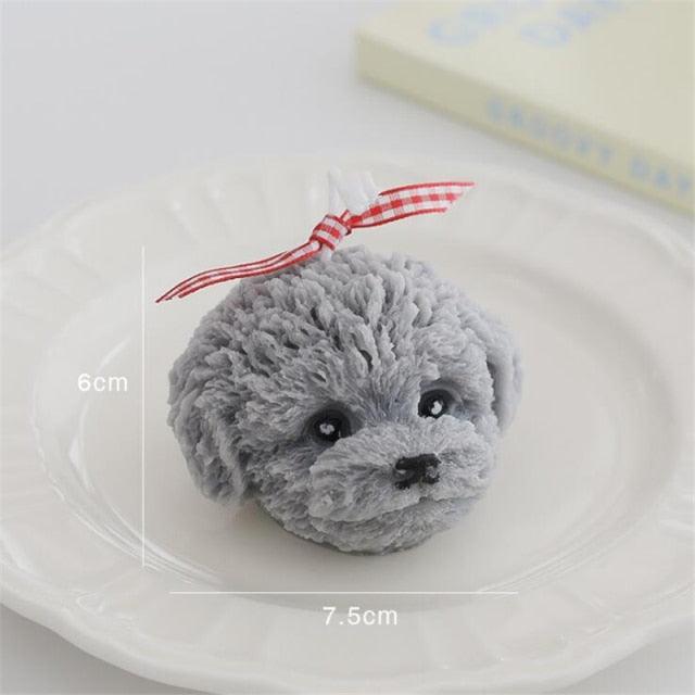 Stevvex teddy bear shaped scented candle in grey plush with a red gingham bow, 6cm tall and 7.5cm wide on Tampa Home & Garden Store