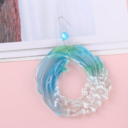 Stevvex ocean sun-catcher wind chime, blue-green acrylic ring with coral accents, hanging decor on Tampa Home & Garden Store
