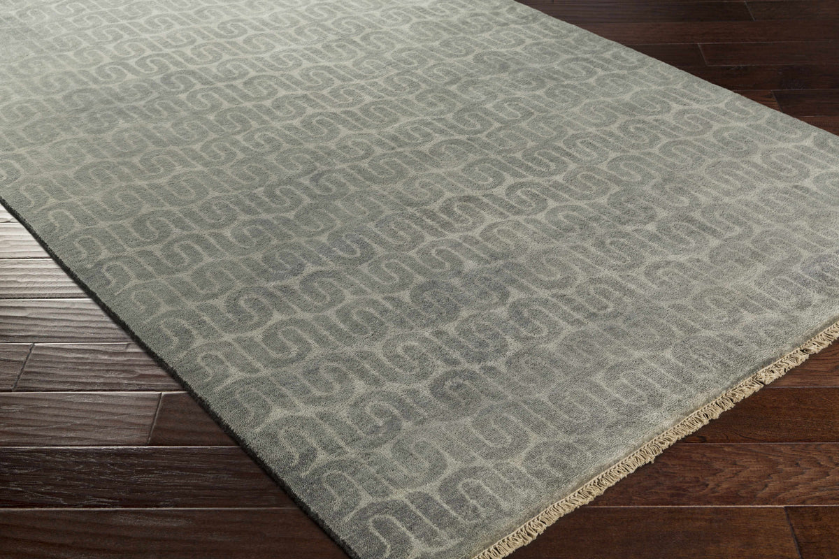 Hannaford Wool Carpet Rug by Boutique Rugs in gray with subtle geometric loop pattern and fringe on Tampa Home & Garden Store