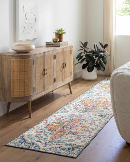 Bodrum Area Rug by Boutique Rugs; multicolor runner with abstract motif beside a wood sideboard on Tampa Home & Garden Store