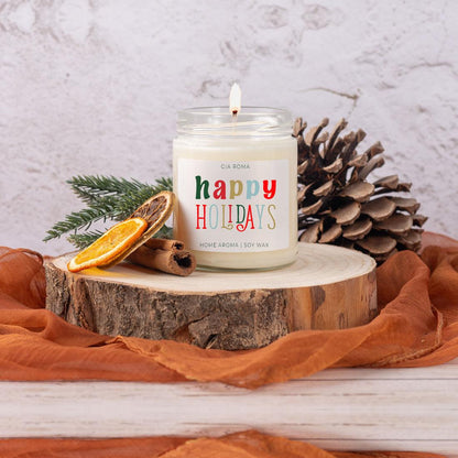 Happy Holidays Candle by Gia Roma, soy wax in a glass jar with lit wick on wood slice on Tampa Home & Garden Store