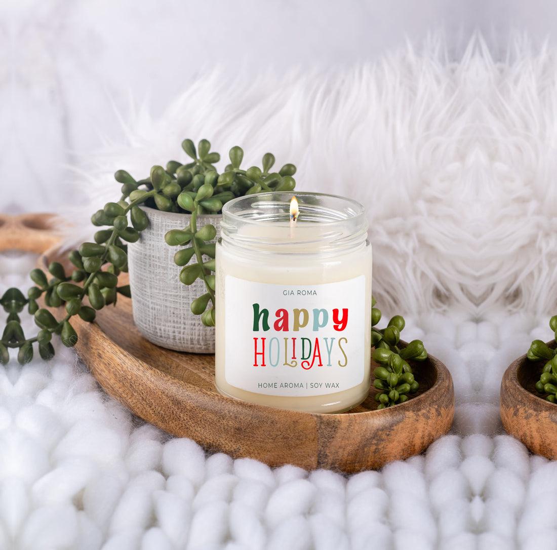Happy Holiday candle by Gia Roma in a glass jar with white soy wax on a tray with greens on Tampa Home & Garden Store