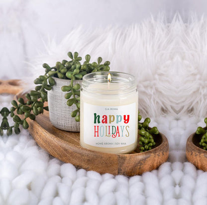 Happy Holiday candle by Gia Roma in a glass jar with white soy wax on a tray with greens on Tampa Home & Garden Store