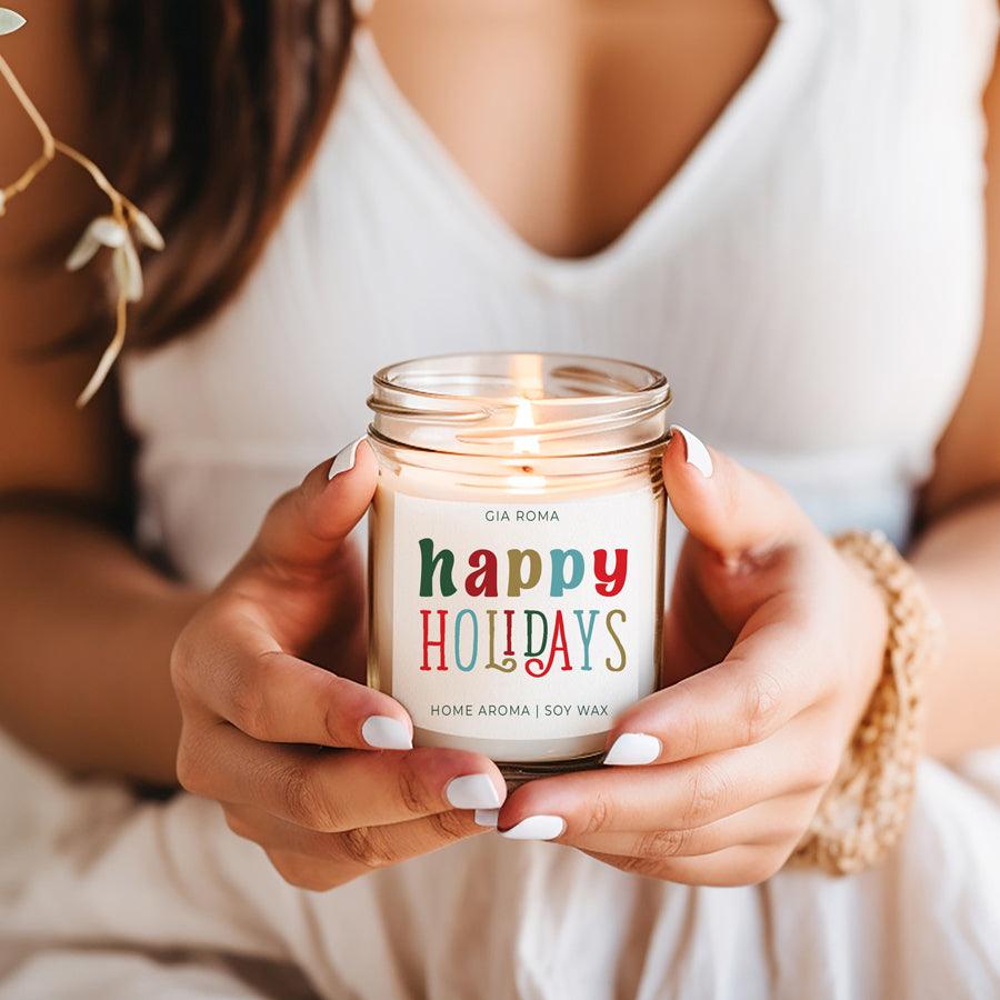 Candle Gia Roma Happy Holidays jar candle, white glass, soy wax, held in hands on Tampa Home & Garden Store