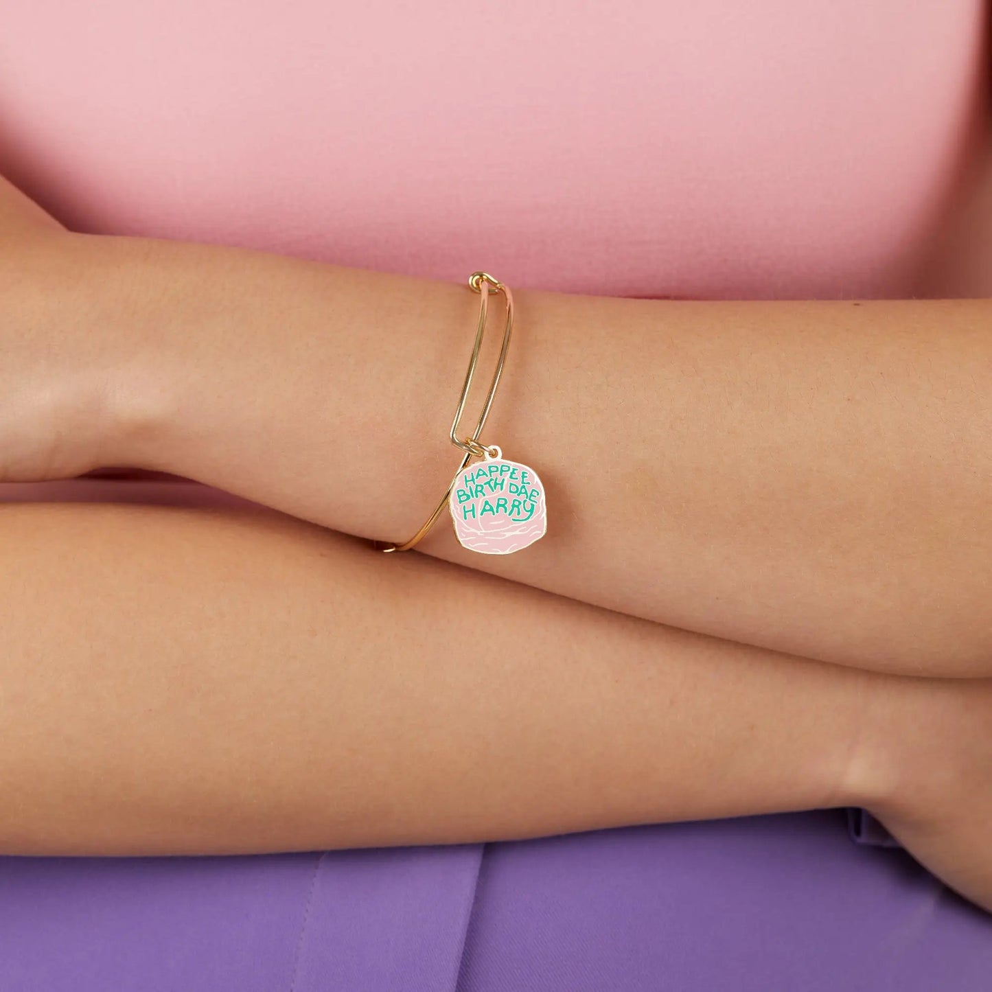 Harry Potter Celebrate Cake Charm Bangle gold-tone bracelet with pink enamel charm on Tampa Home & Garden Store