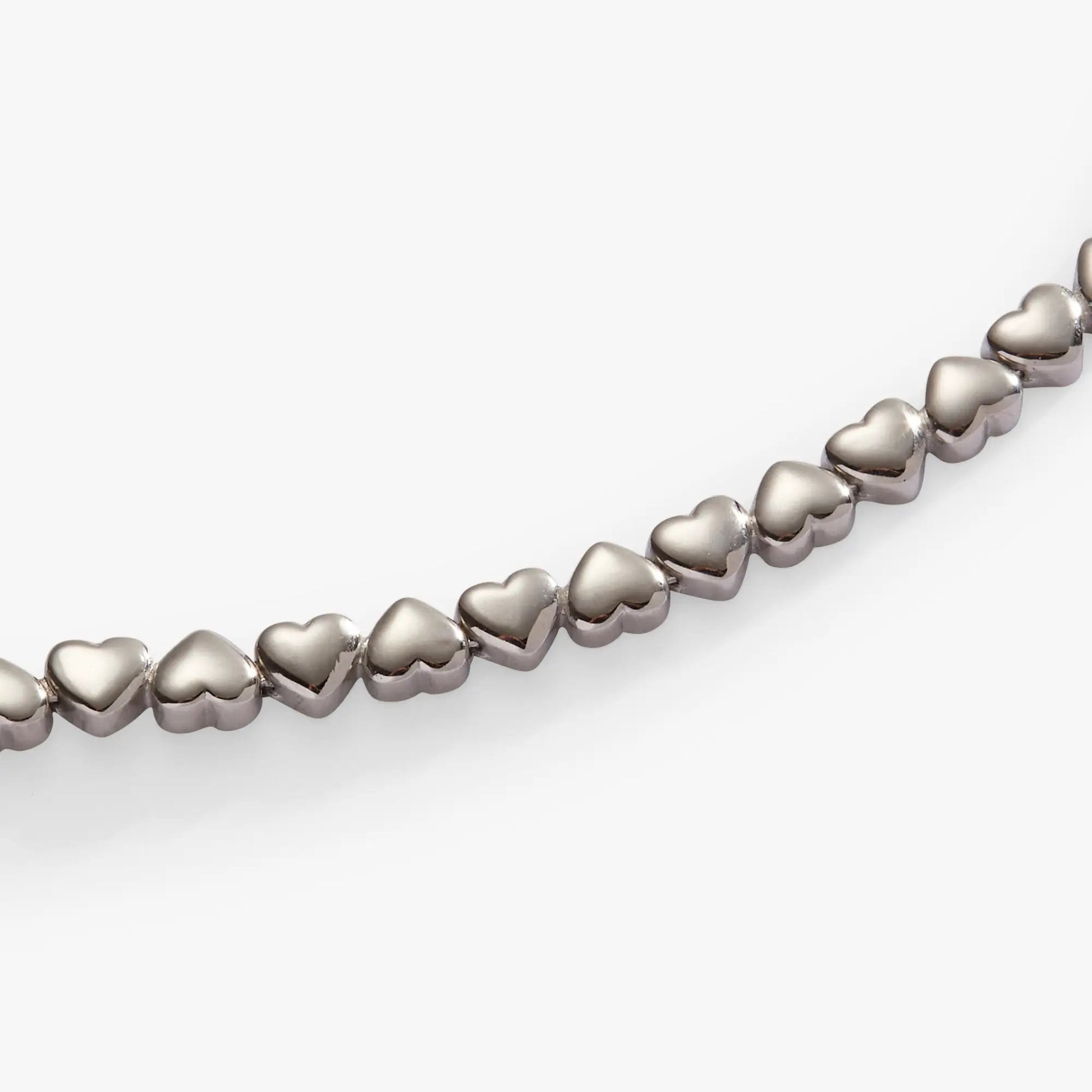 Heart Charm Tennis Bracelet with silver-tone heart-shaped links on Tampa Home & Garden Store