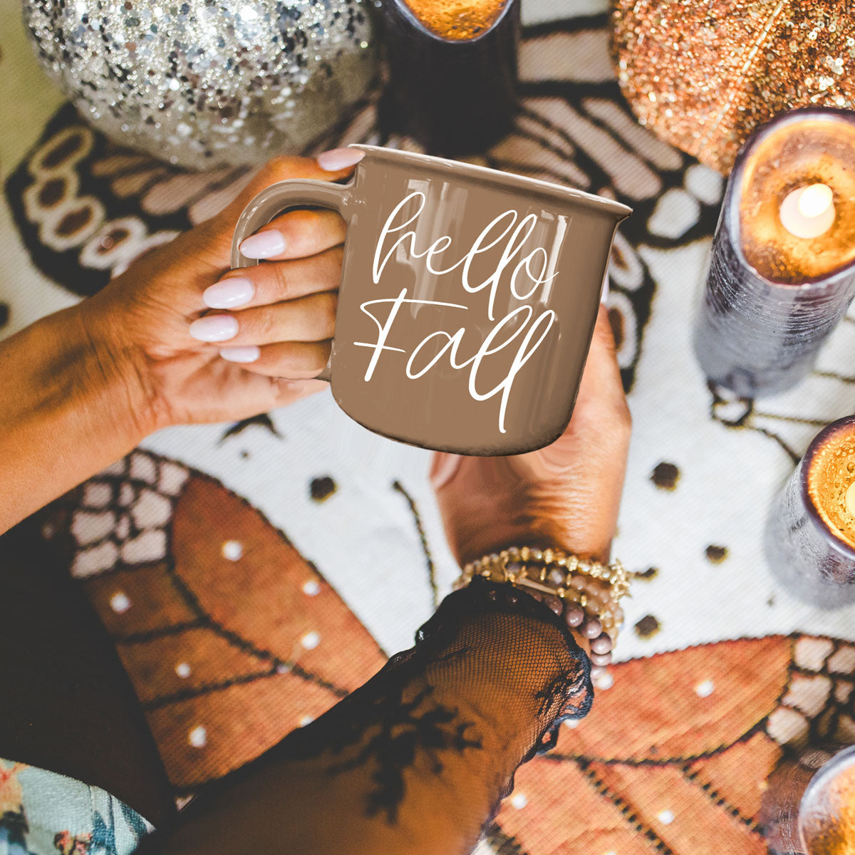 Hello Fall coffee mug by Gia Roma in taupe with script, held by hands amid autumn decor on Tampa Home & Garden Store