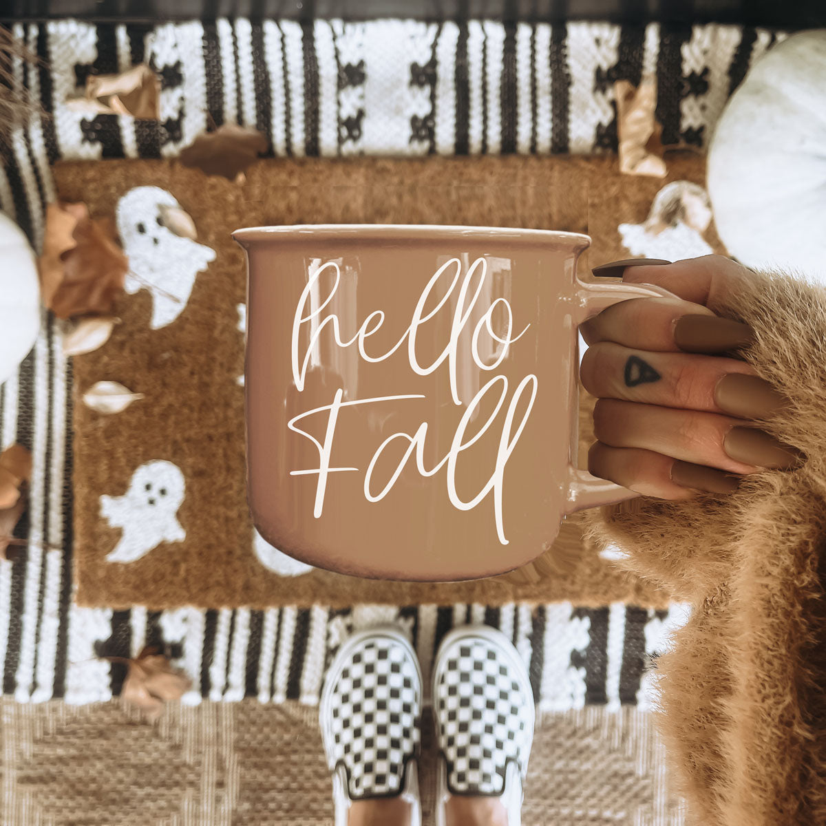 Gia Roma Hello Fall mug in taupe with white cursive script, held in hand on Tampa Home & Garden Store