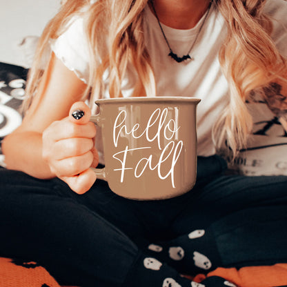 Hello Fall coffee mug by Gia Roma in taupe with white script, held in hand on Tampa Home & Garden Store