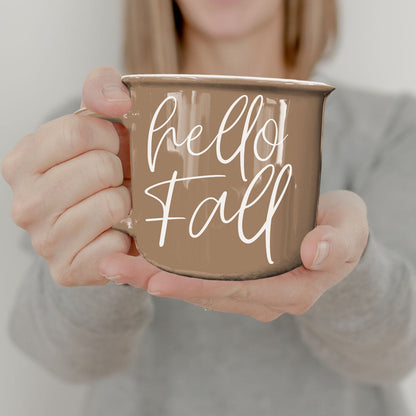 Hello Fall coffee mug by Gia Roma, taupe ceramic with white script held by hands on Tampa Home & Garden Store