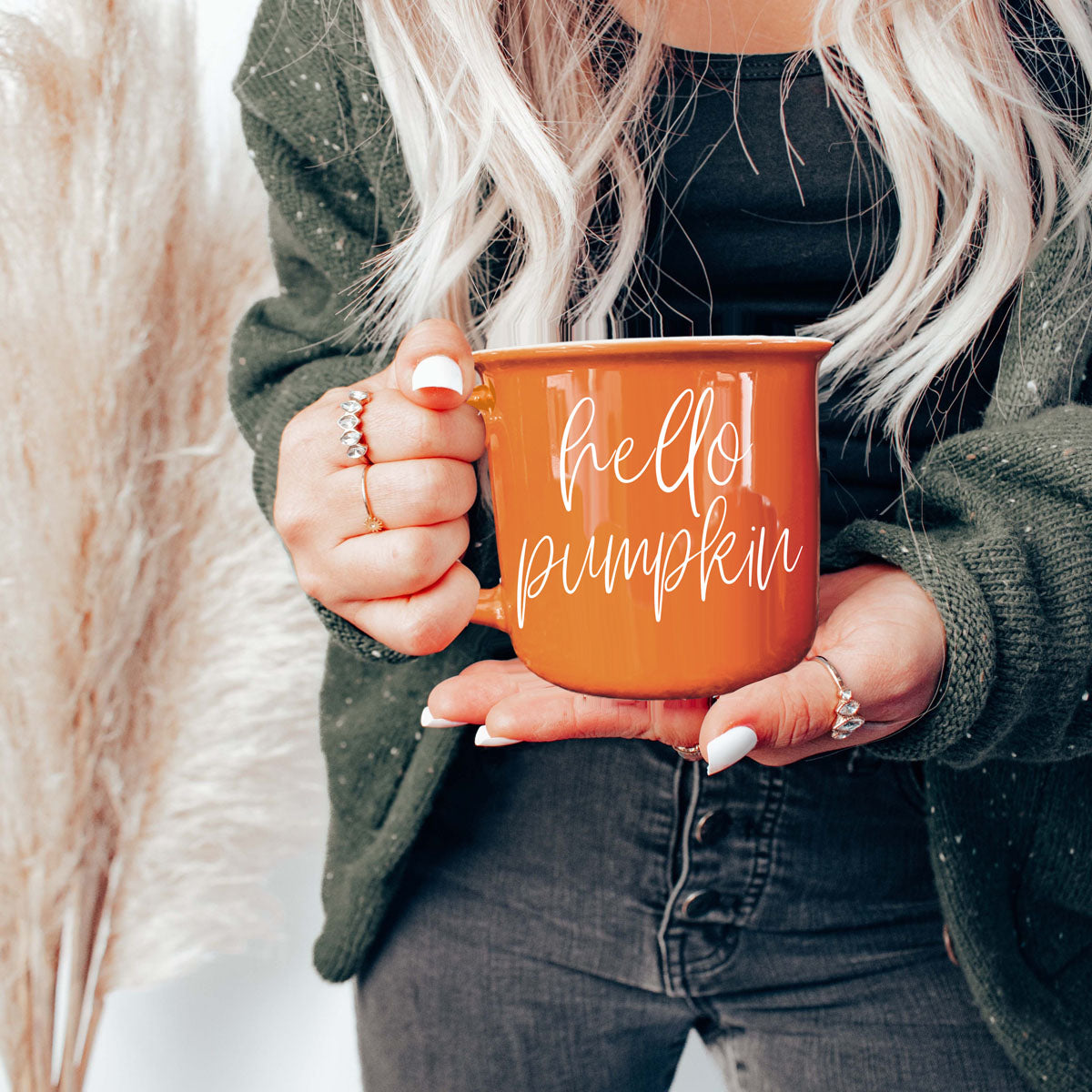Hello Pumpkin coffee mug orange ceramic with white script held by a person on Tampa Home & Garden Store