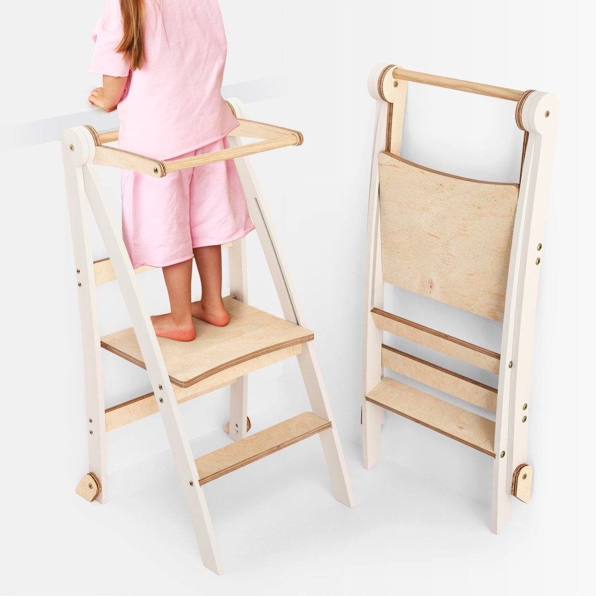 Goodevas Helper Tower toddler step stool, white frame with natural wood steps, foldable, 2 shown on Tampa Home & Garden Store
