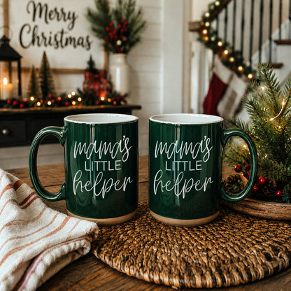 Two dark green Gia Roma Mama's Little Helper coffee mugs with white script on a holiday table on Tampa Home & Garden Store