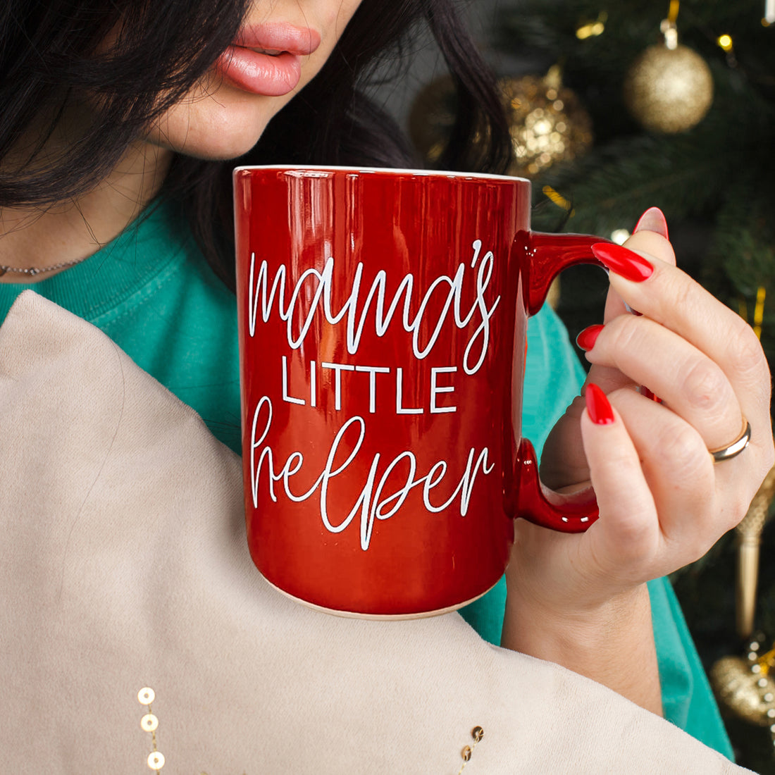 Mama's Little Helper coffee mug by Gia Roma, red ceramic with script, held by red-nail hands on Tampa Home & Garden Store