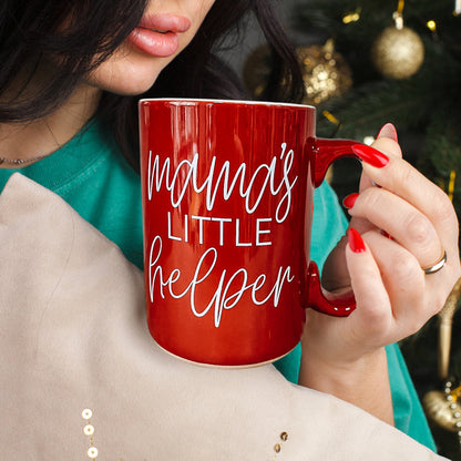 Mama's Little Helper coffee mug by Gia Roma, red ceramic with script, held by red-nail hands on Tampa Home & Garden Store