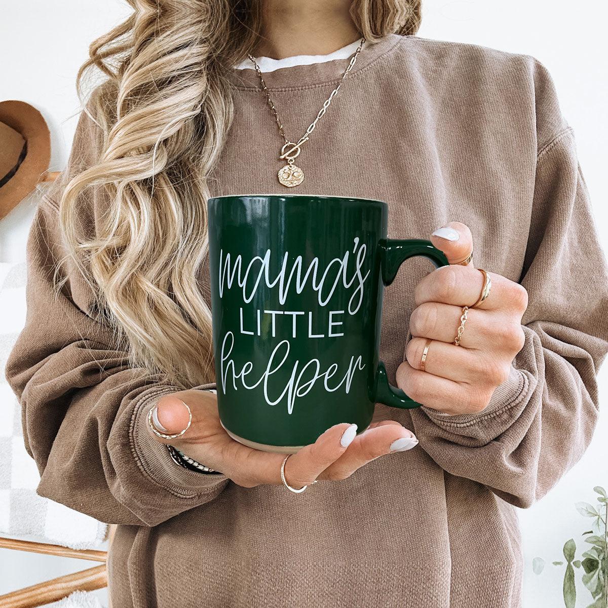 Mama's Little Helper mug, Gia Roma, green ceramic, held by a woman in beige sweater on Tampa Home & Garden Store
