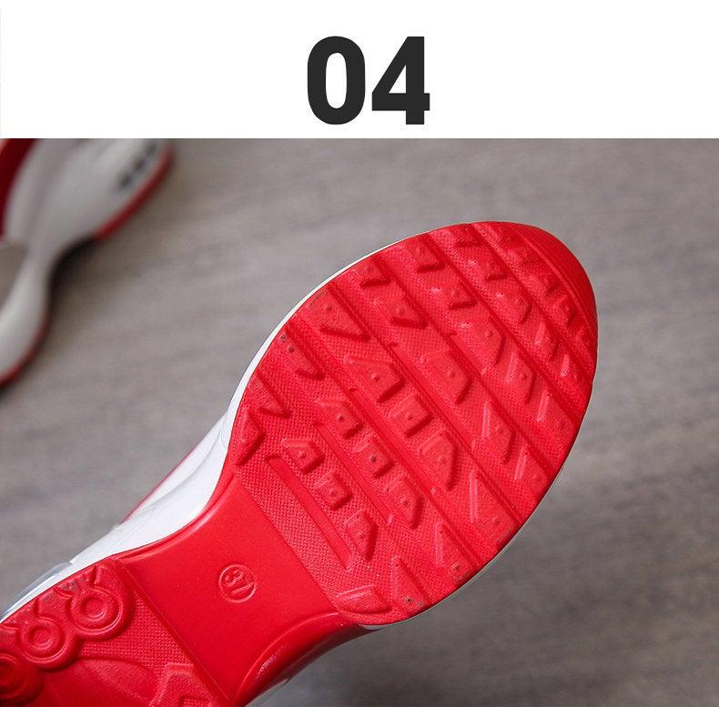Sneaker outsole in bright red with textured tread pattern, white midsole edge visible on Tampa Home & Garden Store