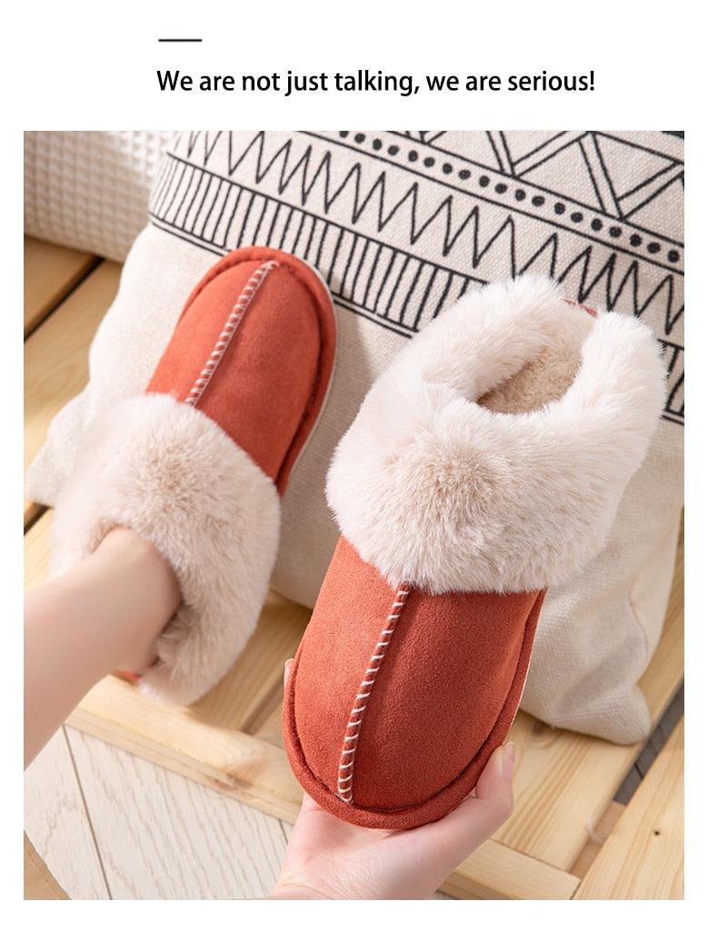 Women's orange suede cowhide slippers with plush cream fur lining and stitched seam detail on Tampa Home & Garden Store