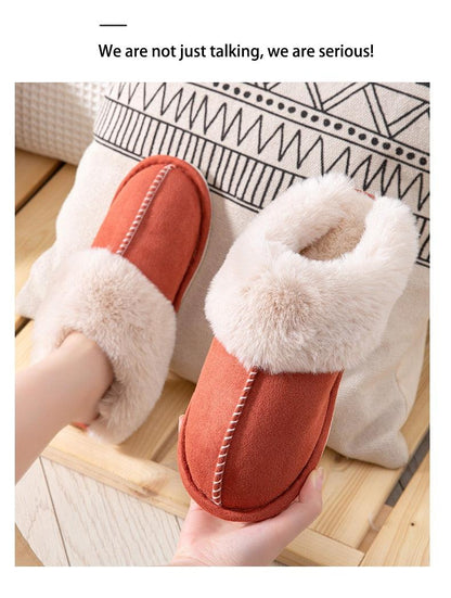 Women's orange suede cowhide slippers with plush cream fur lining and stitched seam detail on Tampa Home & Garden Store