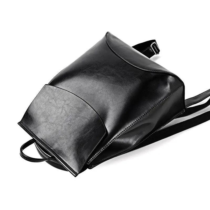Leather backpack by Stevvex in black with large capacity and curved front pocket on Tampa Home & Garden Store