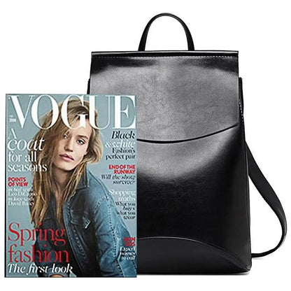 Stevvex black leather backpack large capacity beside Vogue magazine on Tampa Home & Garden Store