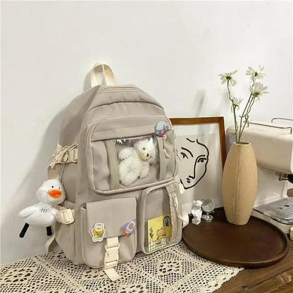 High Quality Nylon Waterproof Backpack Stevvex beige with clear pocket and plush keychains on Tampa Home & Garden Store