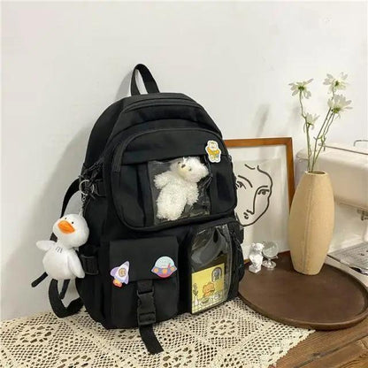 Stevvex nylon large capacity waterproof school backpack in black with plush snowman keychain on Tampa Home & Garden Store