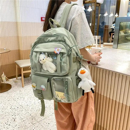 Nylon school backpack sage green waterproof with multiple pockets and duck plush keychain on Tampa Home & Garden Store